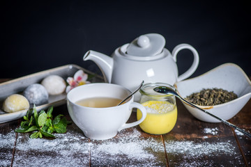 wood table with delicious desserts and tea