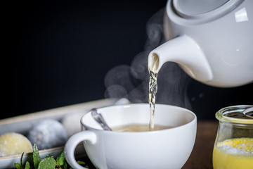 Mochi dessert and pouring tea