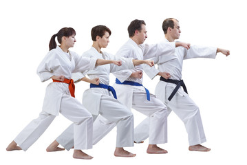 Four adults sportsmen are beating punch arm isolated