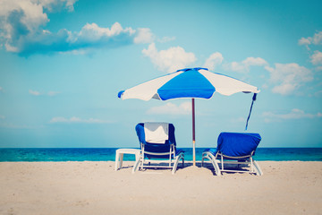 chairs on tropical sand beach