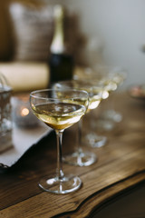 Five Champagne Glasses on a Vintage wooden table