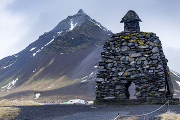 Stone monument to mythological hero Bardur Snaefellsas in Arnarstapi. 