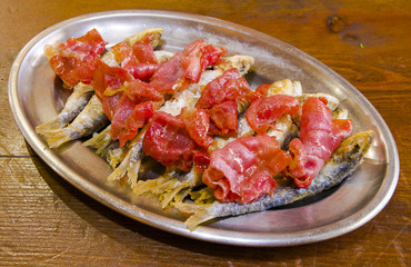 Fried sardines with cured ham dish - Spanish tapas