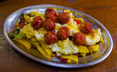 Scrambled eggs with red sausage