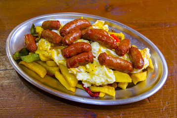 Scrambled eggs with red sausage