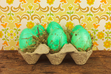 Crate with easter eggs on a wooden table