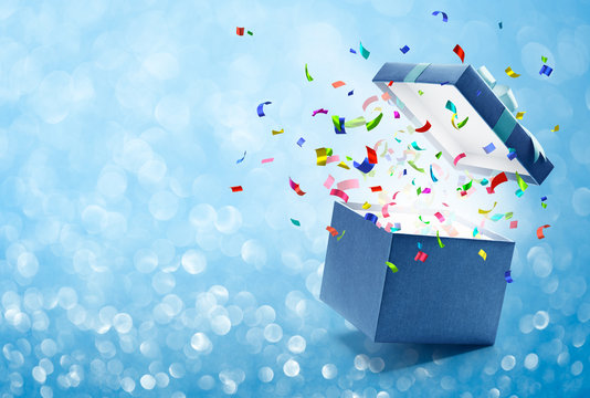 Confetti popping out from blue gift box