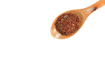 brown rice in wood spoon Close up on white background