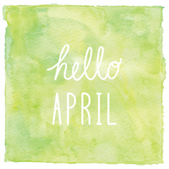 Hello April text on green watercolor background