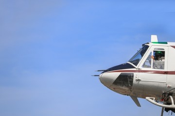 helicopter moving in blue sky with blur propeller