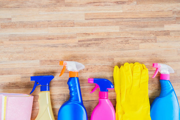 Spring cleaning concept - colorful sprays bottles and rubbers border