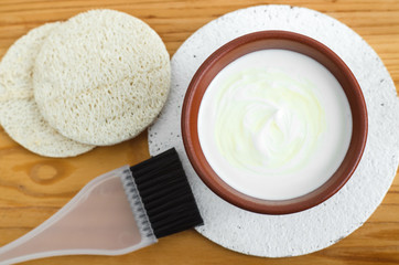 Homemade mask made of sour cream (greek yogurt) and olive oil. Diy cosmetics