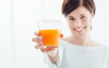 Woman holding a glass of juice