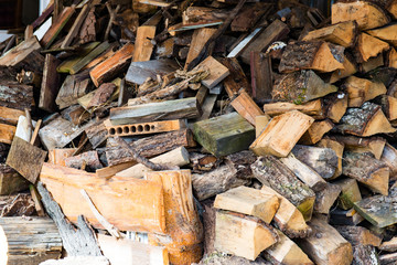 Plenty of firewood for the fireplace in a pile