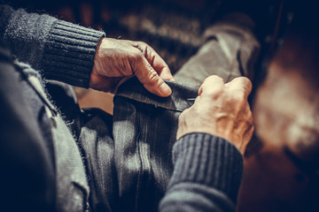 Tailor sewing some fabric