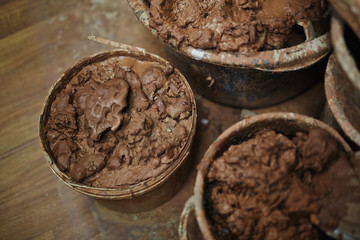 Several large containers with fireclay