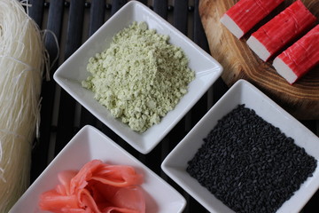 preparing sushi, preparing Japanese food, components for sushi, conponents fo Japanese food, ginger, wasabi, black sesame, sesame, chopsticks, surimi, 