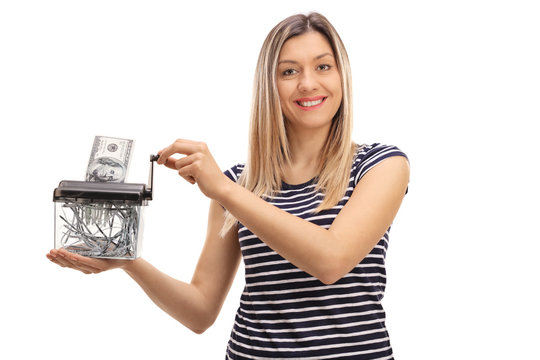 Happy Woman Destroying A Dollar Banknote In A Paper Shredder