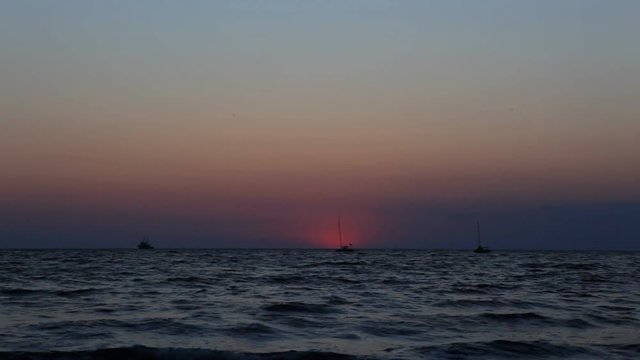 Fascinating Landscapes. Sailing yachts at sunset background
