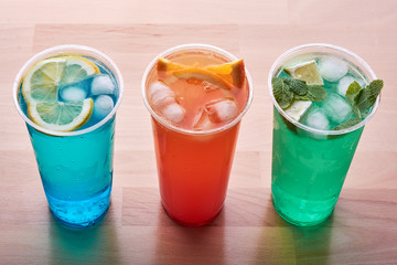 Three colorful drinks.