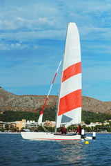 Sailing yacht in the sea bay.