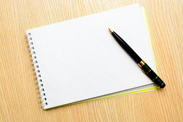 Blank of brochure is on a wooden desk. Template for your design.