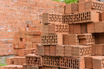Red bricks in stack and pallet