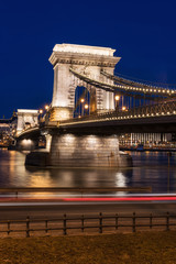Night view of Budapest, Chain bridge (Szechenyi lanchid) in city lights, famous tourist destination, vertical background