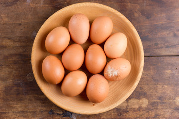 Eggs on wooden plate