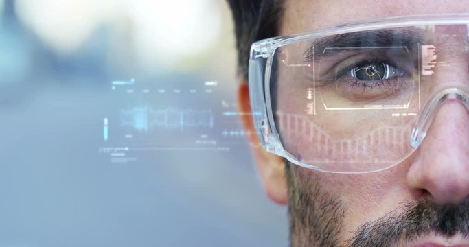 A man watches with a futuristic look with glasses augmented reality in holography. Concept: immersive technology, future, eyes, and futuristic vision.