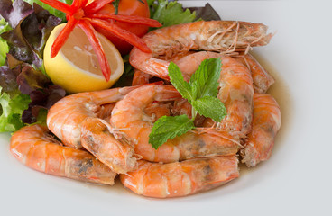 Shrimp boiled with honey and salt on white background