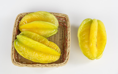 Carambola in a basket isolated on white background