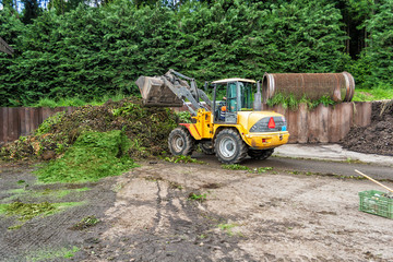 WEINFELDEN, SWITZERLAND - JUNE 22 2010: Industrial composting. Mixing ingredients