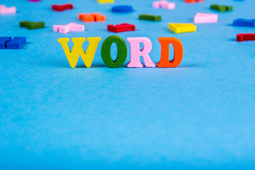 Word word from colored wooden letters.