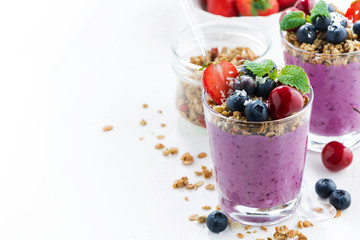 Blueberry dessert with fresh berries and granola and white background