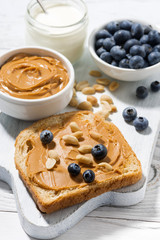 toast with peanut butter and blueberry, closeup