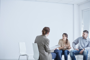 Married couple talking with therapist