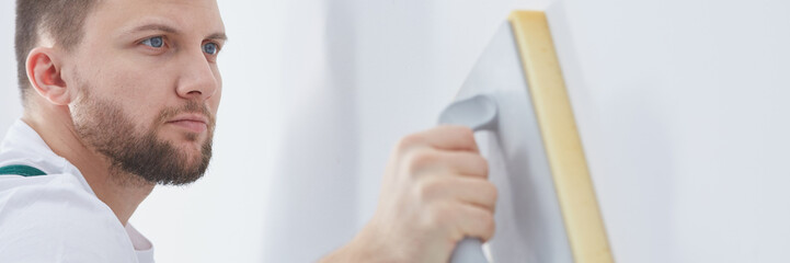 Professional contractor plastering wall