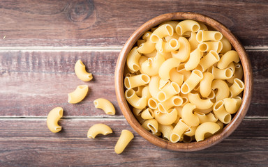 Raw macaroni on wooden background,Top view