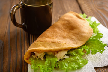 Home made fastfood with coffee on wooden table