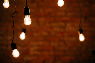 Light bulbs in interior over dark wall
