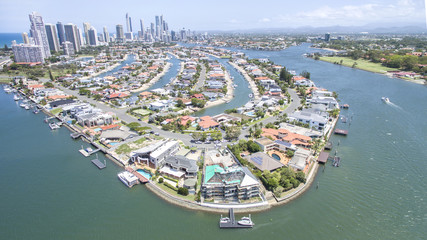 Aerial view of Macintosh Island waterfront properties, facing south with Surfers Paradise in the horizon - obrazy, fototapety, plakaty