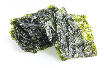 Japanese food nori dry seaweed sheets on white background © showcake