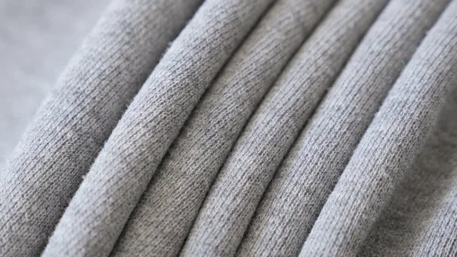 Gathers of fine sweating shirt or pants fabric texture close-up 2160p 30fps UltraHD tilting footage - Cotton training piece of cloth slow tilt 4K 3840X2160 UHD video 