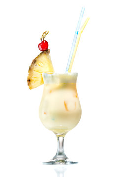 Cocktail pina colada with a piece of pineapple isolated on white background