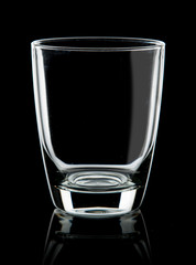 Empty glass for water on black background