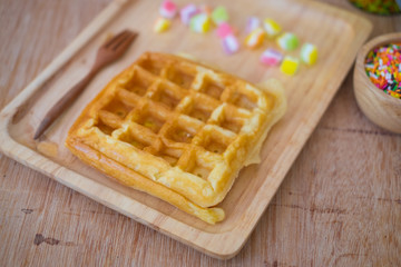 Homemade waffles on wood tray