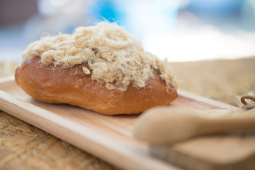 Bun with sweet dried pork on top