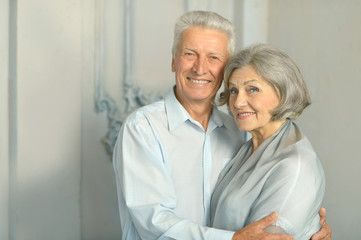 Happy elderly couple embracing