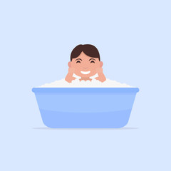 Naklejka premium Vector cartoon little baby bathes in a small bath